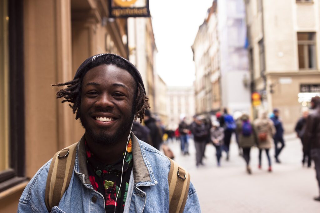 Smiling young man on a city street 