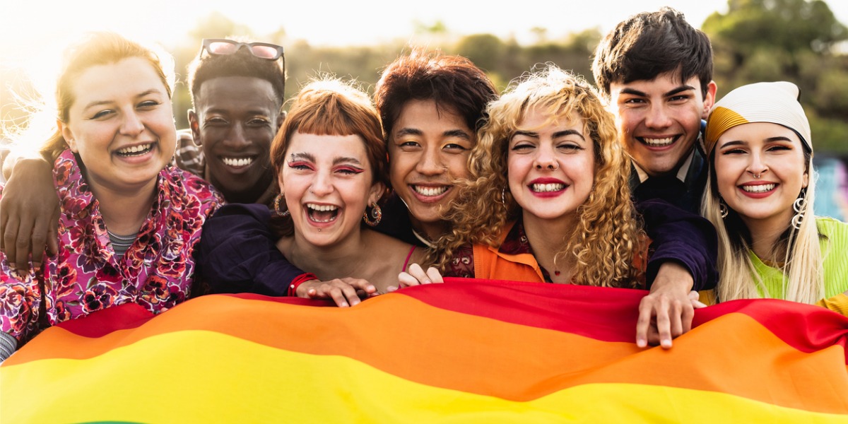 teens holding gay pride flag