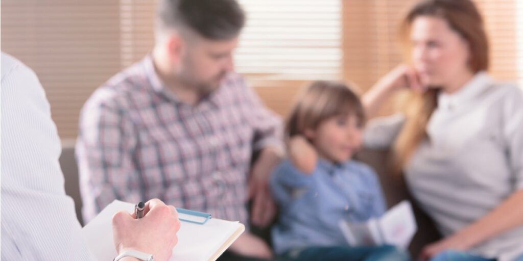 child with parents in therapy