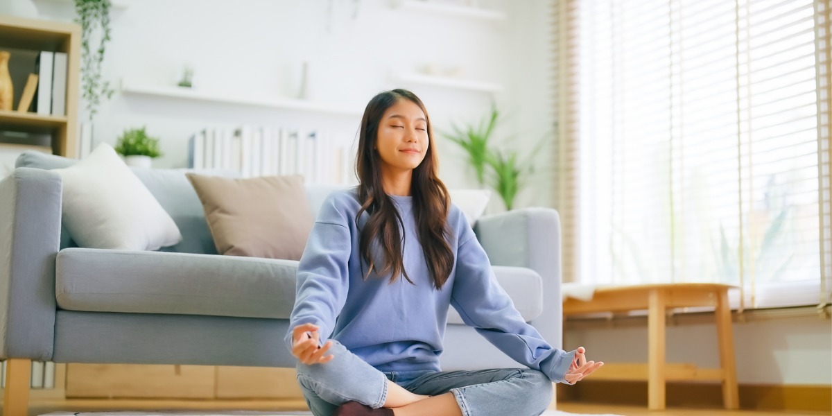 woman sitting practicing meditation