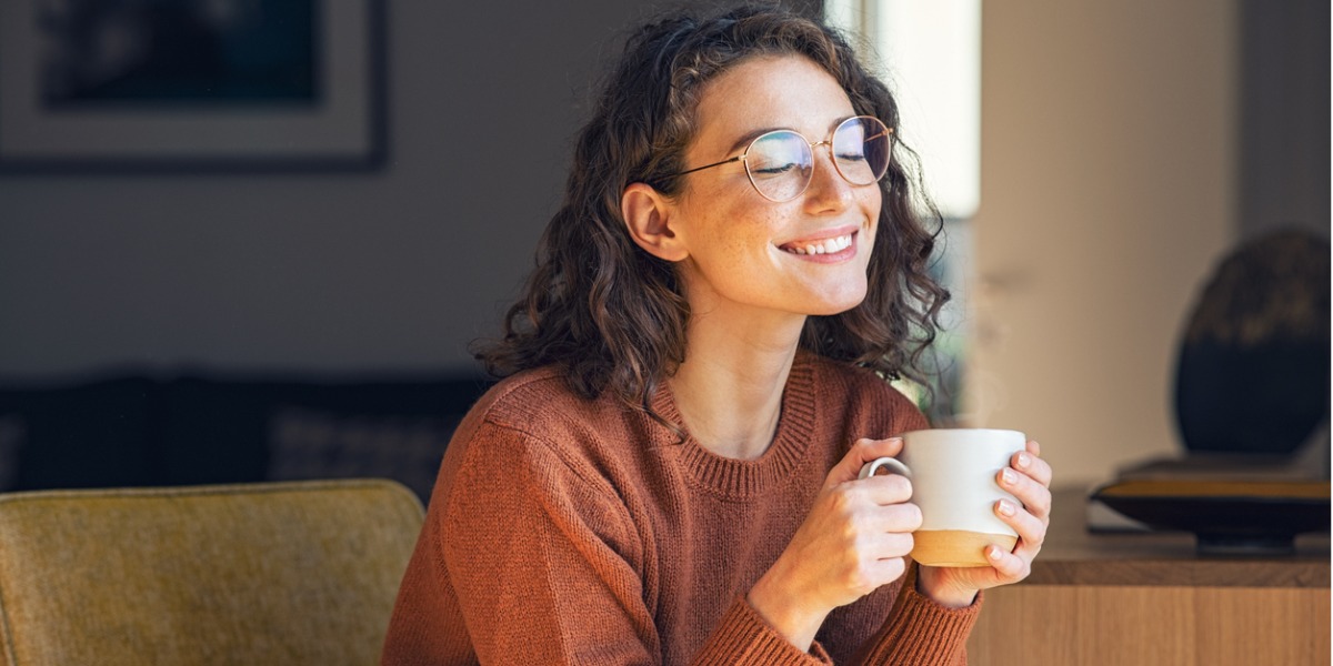 young adult relaxes drinking cup of coffee