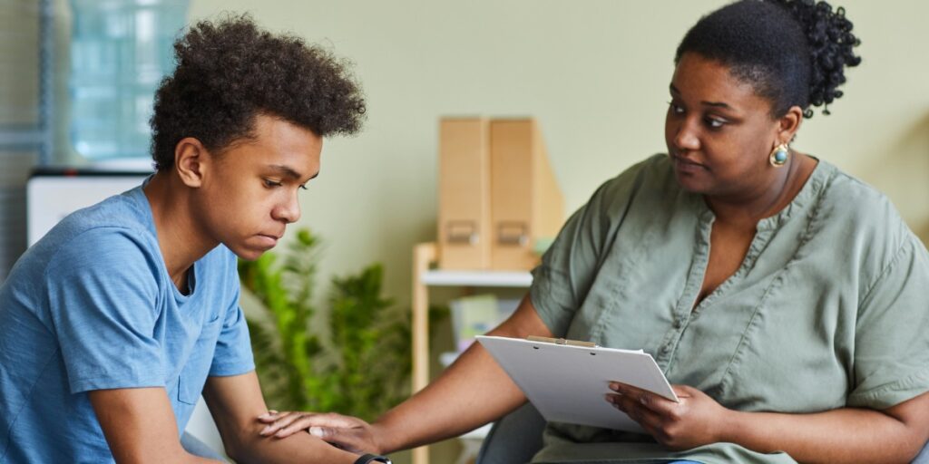 black teen with therapist