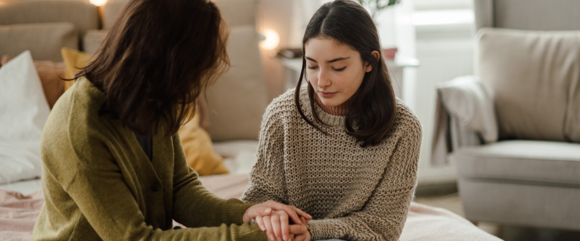 mother having serious talk with teen daughter