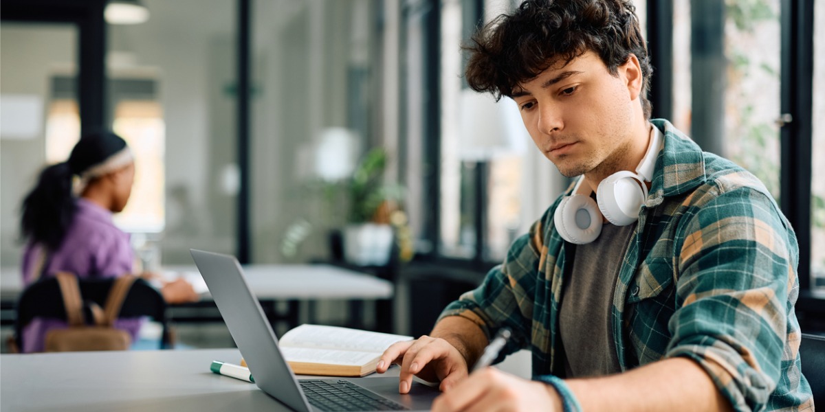 college student studying with laptop