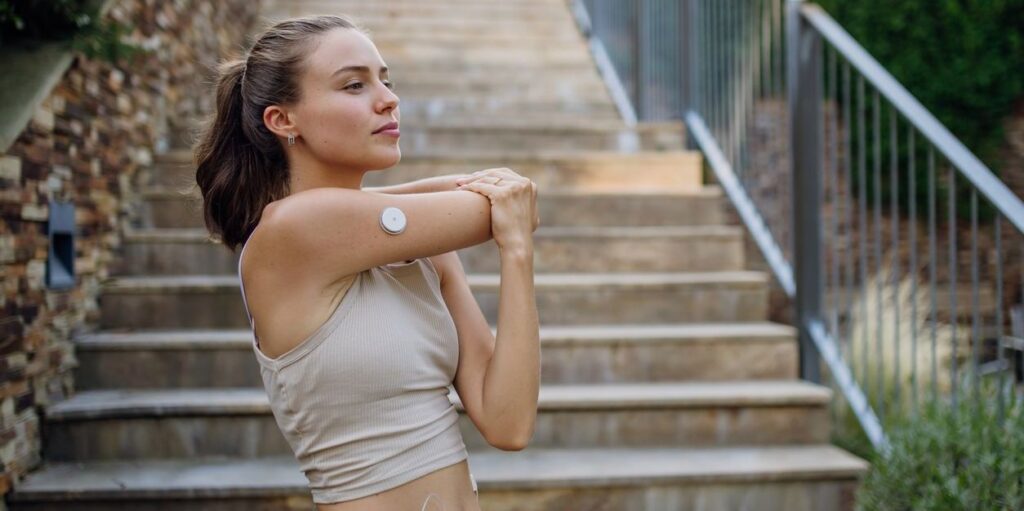 woman stretching arm during exercise