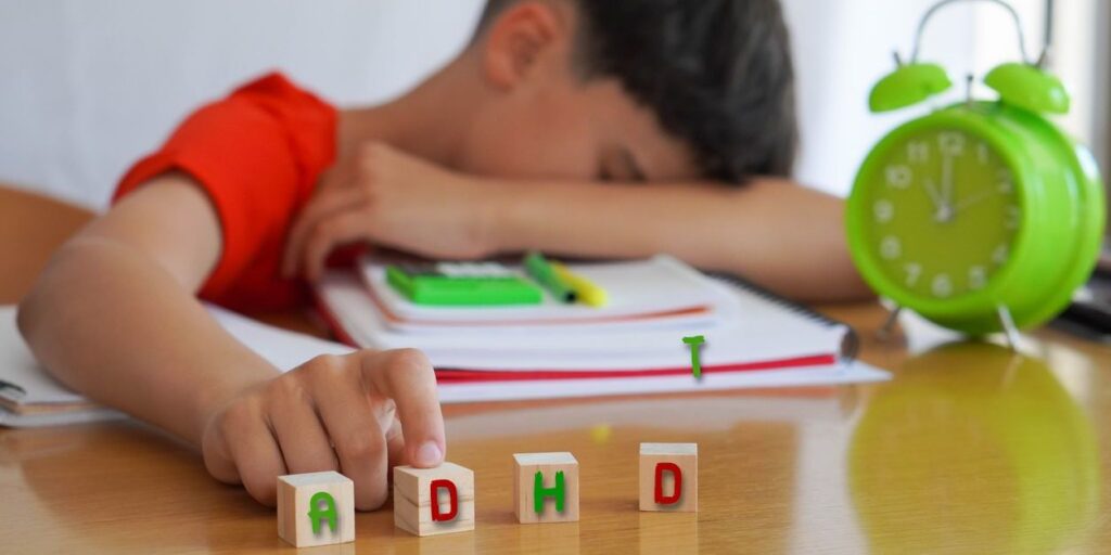 young boy with head down and adhd cubes