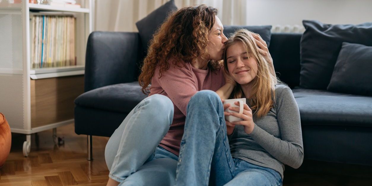 mom sitting with teen daughter to represent parenting style