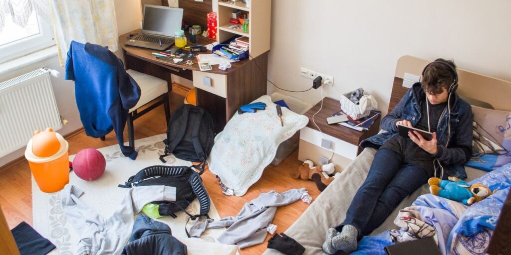 teen sitting in bedroom refusing to go to school